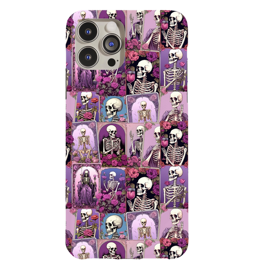 a phone case with skulls and flowers on it